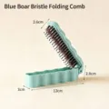 Portable blue foldable hairbrush with pig bristles, compact size 12x3cm for travel use - Blue