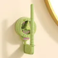 Wall-mounted green rotating suction cup hook for organizing hair scrunchies and headbands - 1 Piece / Green