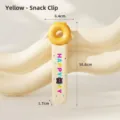 Yellow snack clip for hands-free eating, anti-slip food tweezers with dimensions. - Yellow