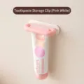 Pink and white wall-mounted toothpaste squeezer holder for bathroom use - Pink