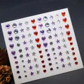 Self-adhesive face gems sheet featuring red hearts, purple stars, and silver rhinestones - Red Purple Silver Heart and Star Gems (E45)