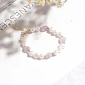 Elegant freshwater pearl bracelet with lavender stones and gold-plated chain clasp. - Three Pearls Lavender Purple Bracelet