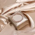 Elegant pink quartz beaded bracelet with gold-tone wire wrap on a premium silk background. - Strawberry Quartz (Adjustable)