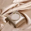 Elegant tourmaline beads wrapped in gold wire bracelet with magnetic clasp on jewelry box - Cherry Blossom Agate (Magnetic Clasp)
