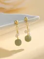 Detailed shot of elegant gold earrings with natural green jade and small white pearls - Spherical Pearl He Tian Jade Earrings / Stud Pin Style / Light Green