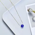 Minimalist gold chain necklace featuring a single round blue bead pendant - Lapis Lazuli / Gold