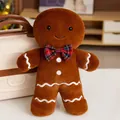Soft brown gingerbread man plush toy featuring a checkered bow tie in cozy room - Male Gingerbread Man Pendant / 15cm