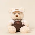Zachte beige pluche teddybeer met witte golfklep en bruine tuinbroek voor kinderen - Broken Wit / 28cm