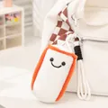 Cute plush boxing sandbag keychain with smiley face hanging on a white canvas tote bag. - White Sandbag