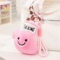 Adorable pink plush boxing glove bag charm featuring a smiley face and THE KING text - Pink Mittens
