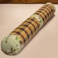 Long cylindrical rattan bolster pillow with floral fabric ends and checkered pattern - 65*20cm / Magnolia Pattern