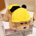 Cute teddy dog plush toy wearing a yellow bee costume in a prone position on a white desk. - 32cm / Bee Cape Style / Beige