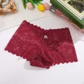 Detailed flat lay of burgundy floral lace panties on a white textured background - Wine Red