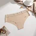 Comfortable seamless low-waist beige bikini panty featuring a delicate floral lace waistband - Nude