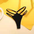 Detailed macro view of black ribbed thong underwear with stylish double waist straps - S / Bottoms / Black