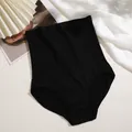 Close-up of black seamless high waist shaping panties detailing the rib knit texture - M / Bottoms / Black