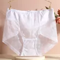 Detailed view of white high-waisted lace panties with delicate mesh pattern - S / White