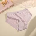 Detailed view of pink breathable mid-waist briefs with mesh panels and a bow detail - S / Bottoms / Light Apricot