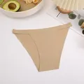 Detailed view of beige seamless ice silk bikini panties featuring a breathable fabric - S / Bottoms / Nude