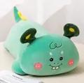 Close-up detail of a cute green monster plush pillow showing soft embroidered face features - Green / 50cm