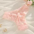Elegant pink lace thong panties with cute bow detail on soft white textured background - Nude