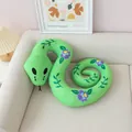 Close-up of green plush snake toy with purple flower patterns on a sofa - Floral Vine Snake / 60CM / Green
