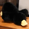 Soft black fluffy platypus plush toy with yellow beak lying flat on a wooden surface - Black Duck / 30cm