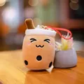 Adorable boba cup plush keychain with smiley face and red strap accessory on desk - Squinting Eyes Style (Meihua) / 10cm / Brown