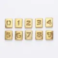 Detailed macro view of 8mm golden frosted alloy hollow number charms 0 to 9 for DIY jewelry craft - 0-9 Number Set / 10 Pieces Pack