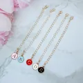 Detailed view of gold chains with colorful alphabet charms and lobster clasps - Thin Chain Letter L / Light gold