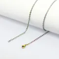 Macro detail of rainbow iridescent stainless steel cross chain with lobster clasp - Cable Chain / 45 and 5cm Length 2.5mm Thickness / Rainbow
