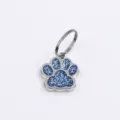 Sparkling blue glitter dog paw pet ID tag pendant with secure metal ring attachment - 15x18mm / Light Blue