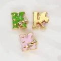 8mm gold-plated enamel letter K charm with rhinestone bow for DIY jewelry - Letter K