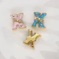 8mm gold-plated letter K slide charm with pink and blue enamel and rhinestone bow - Letter X