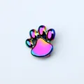 Detailed view of a 10mm rainbow iridescent alloy cat paw print charm accessory. - Dog Paw (SL719) / 10mm / Iridescent