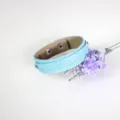 Light blue double-layer faux leather bracelet with snake skin texture and snap buttons - Light Blue