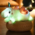 Luminous unicorn plush toy glowing on a woven cushion - Light-up / 50cm / Blue