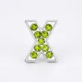 10mm silver alloy 'X' alphabet bead featuring sparkling light green rhinestones for DIY - Letter X
