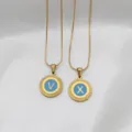 Gold-plated stainless steel alphabet pendants V and X with light blue enamel and textured border - Snake Chain Necklace with Round Lace Pendant / Letter A / Blue