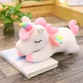 Cute soft white unicorn plush toy with rainbow horn and wings resting on a book - 30cm / White