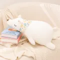 Cuddly soft white polar bear plush toy with a colorful floral scarf resting on books - Foam Particle Model / 53x30cm / White Polar Bear