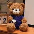 Adorabile orsacchiotto marrone di peluche con divisa da calcio blu che tiene un pallone - Orso Bruno Maglia Blu (Francia)