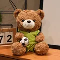Adorabile orsetto di peluche marrone con maglia da calcio verde e un piccolo pallone - Orso Bruno Maglia Gialla (Brasile)