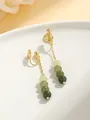 Close-up of elegant gold-toned non-pierced ear clips with gradient green beads - Long Tassel Clip-on Earrings (Hua Zhong Ren) / Mosquito Coil Ear Clip / Gradient Green