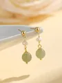 Detailed close-up of elegant gold dangle earrings with green jade beads and white pearls - Pearl Pendant He Tian Jade Earrings / Stud Pin Style / Green and White