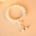 Elegant white Bodhi root bracelet with cute blue cat paw charms for women - Tassel Style / Forget-me-not Blue Single Paw
