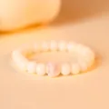 Minimalist white bodhi root beaded bracelet featuring a cute pink cat paw charm - Single Loop Style / Cherry Blossom Pink Single Paw