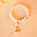 Elegant white Bodhi root bead bracelet featuring cute pink cat paw charms and tassels - Tassel Style / Cherry Blossom Pink Single Paw