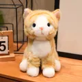 Detailed view of a realistic ginger and white sitting kitten plush toy with blue eyes - Sitting Style - Yellow Cat / 15cm
