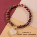 Handcrafted sandalwood bead bracelet featuring a white jade charm and red accent bead - Red Sandalwood and Golden Silk Sandalwood Style